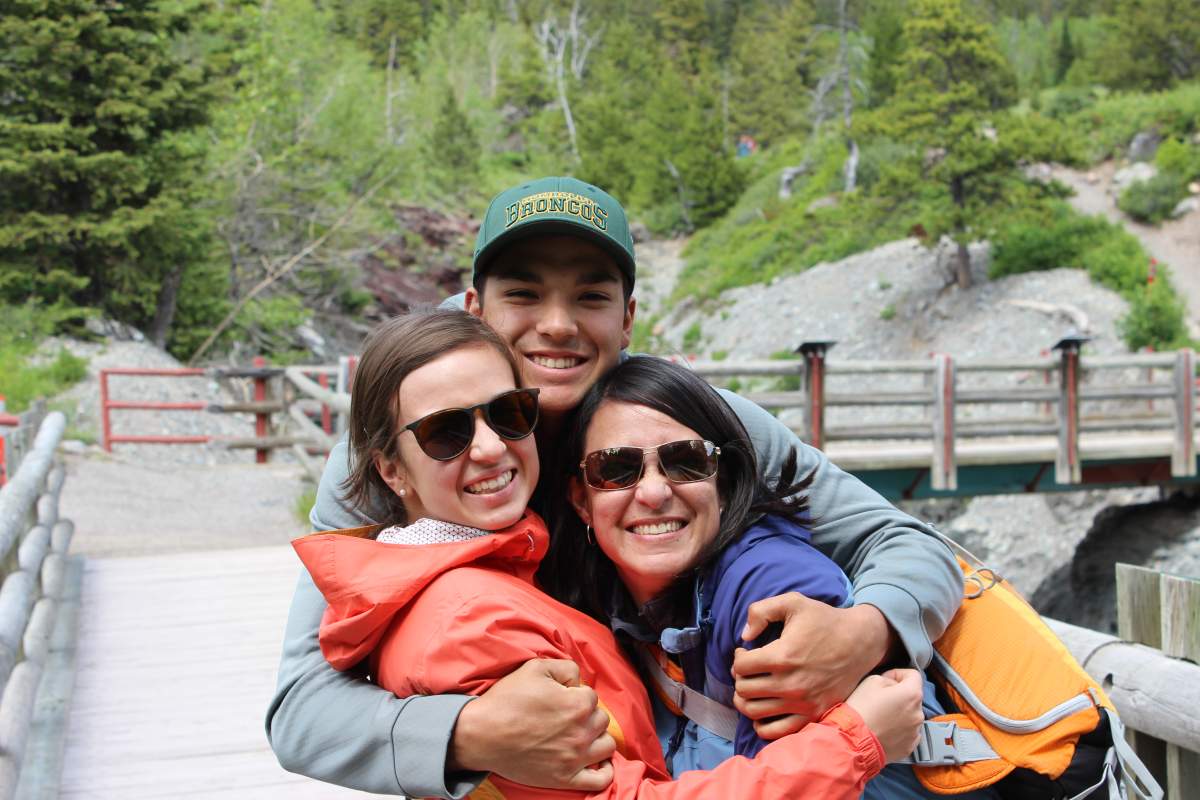 Logan with his sister and his mom.