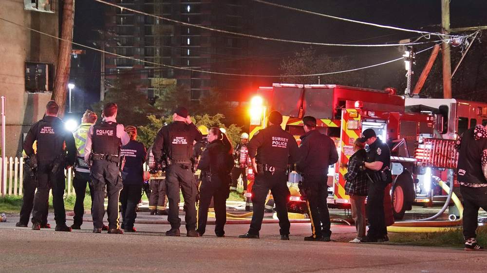 Crews on the scene of an apartment fire in Surrey, B.C., on April 5, 2022.