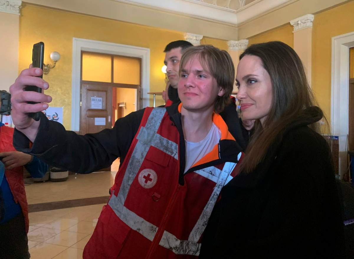 Angelina Jolie, Hollywood movie star and UNHCR goodwill ambassador, poses for photo with her fans in Lviv, Ukraine, Saturday, April 30, 2022. Ms Jolie was in Ukraine to meet the children affected by the war and visited hospitals and NGOs helping the injured and displaced.