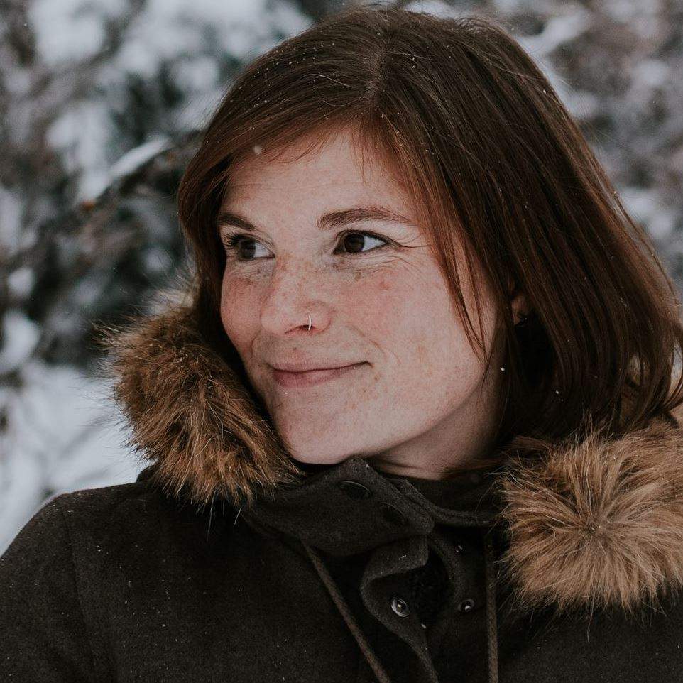 Brianna Sharpe, a freelance writer from Alberta, wearing a wool Roots coat she thrifted off of Facebook Marketplace.