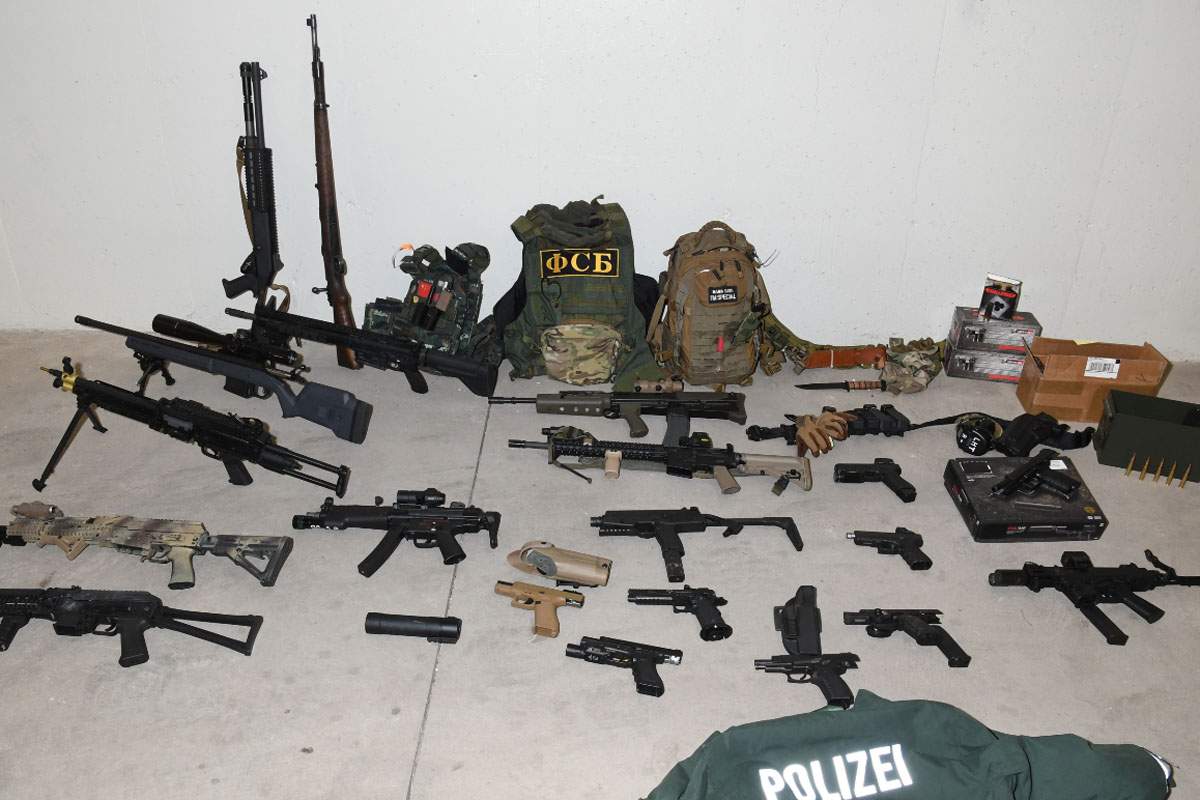 Waterloo Regional Police say officers seized 20 real and replica guns and more than 2,000 rounds of ammunition from an apartment building in Kitchener earlier this week.