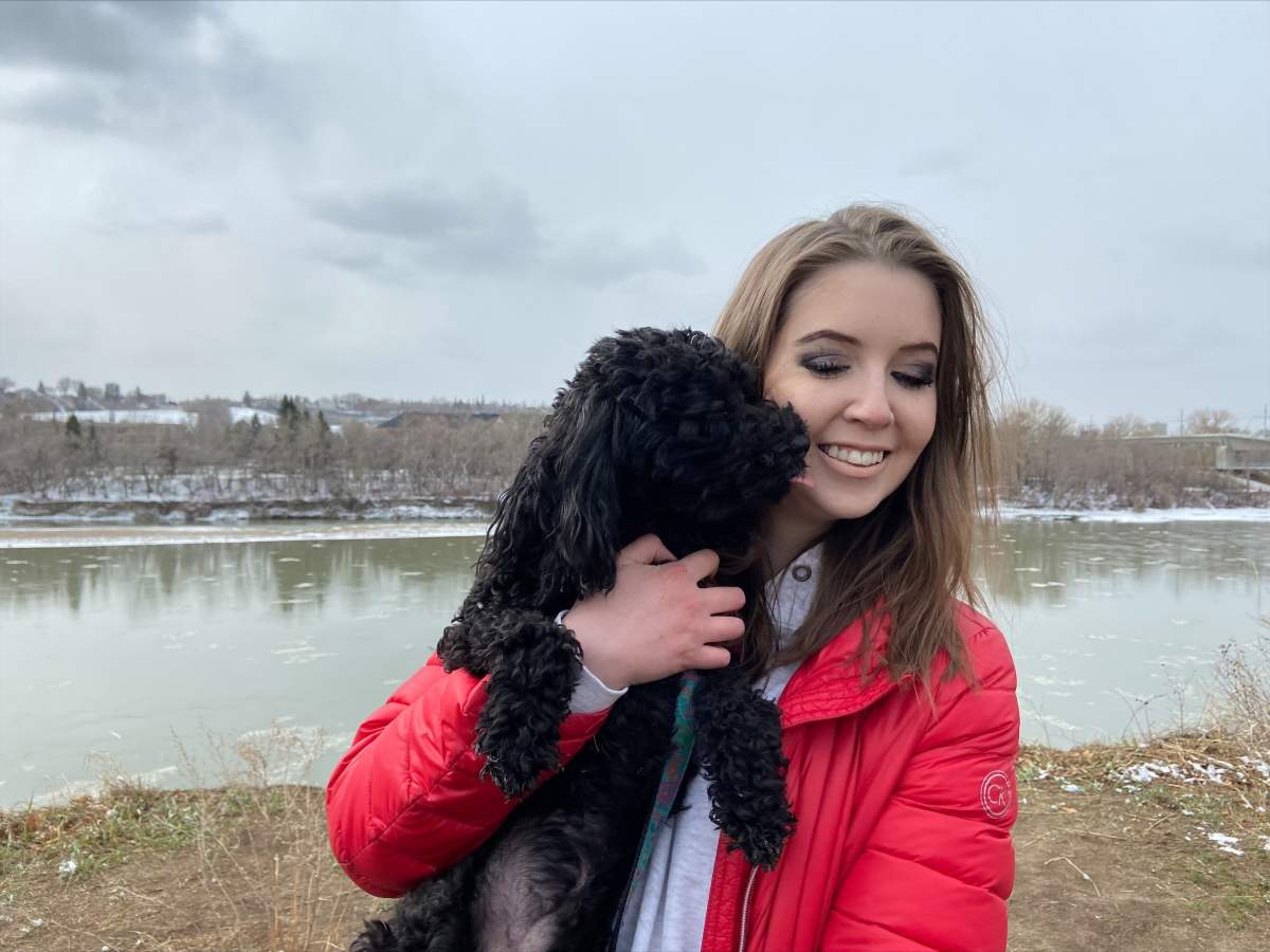 Twenty-four-year-old Maia Stock and her dog Brady.