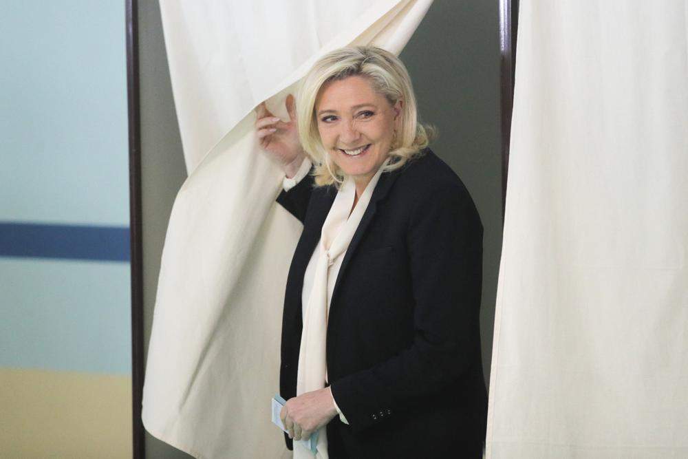 French far-right contender Marine Le Pen casts her vote in Henin-Beaumont, northern France, Sunday, April 24, 2022 (AP Photo/Michel Spingler).