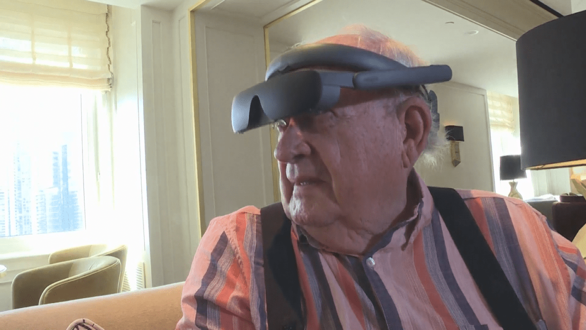 Eric MacDonald tries on his new pair of eSight glasses, gifted to him through not-for-profit charity We Are Young.
