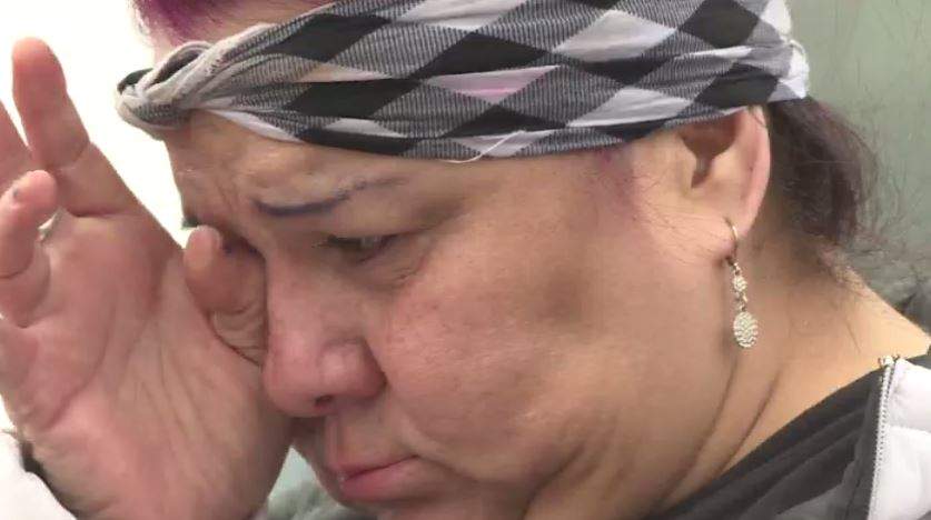 Marless Johnson wipes away tears at the site where her daughters remains were discovered on year ago.