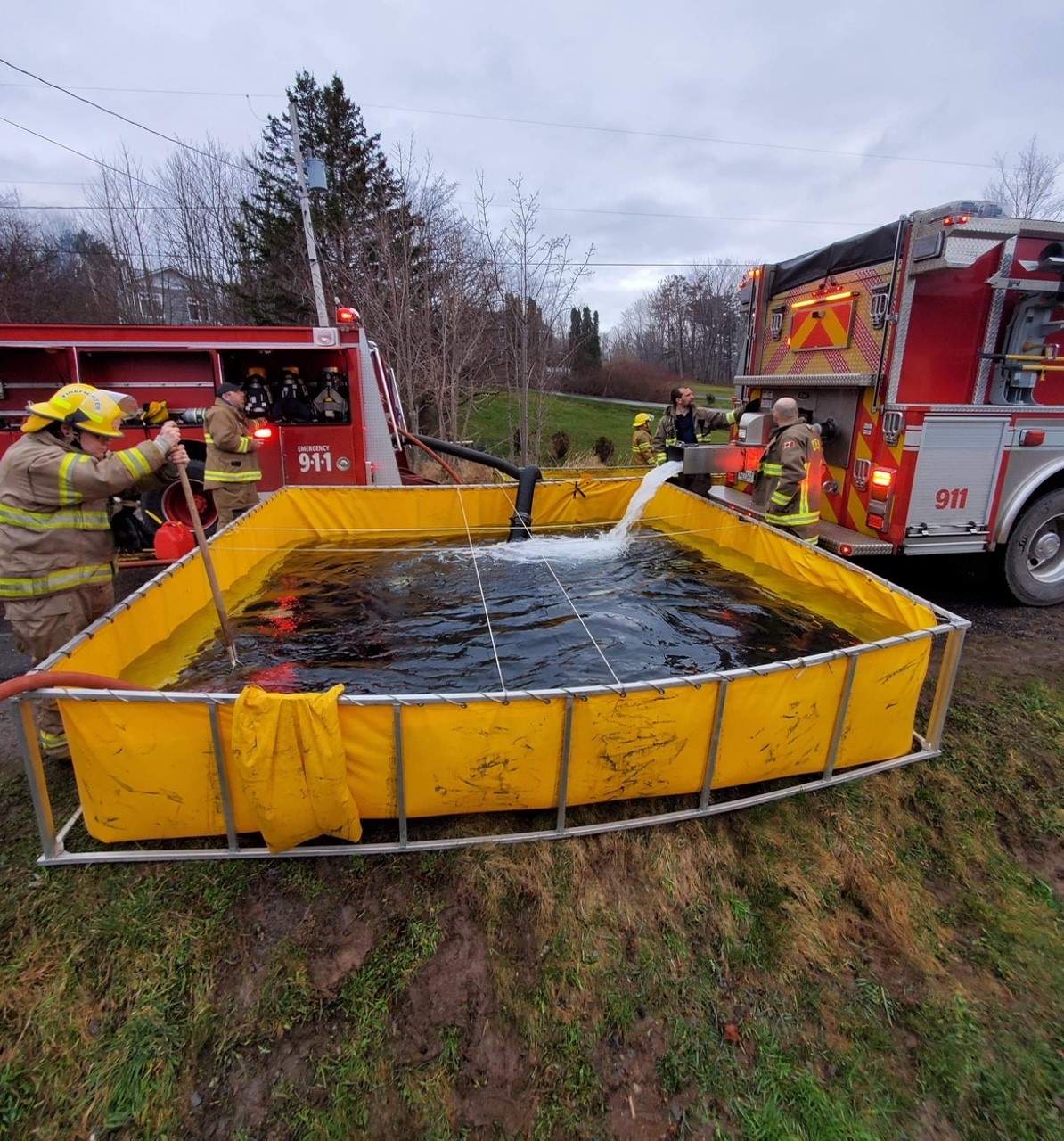 Firefighters are seen outside of a home in flames in Smith’s Cove.