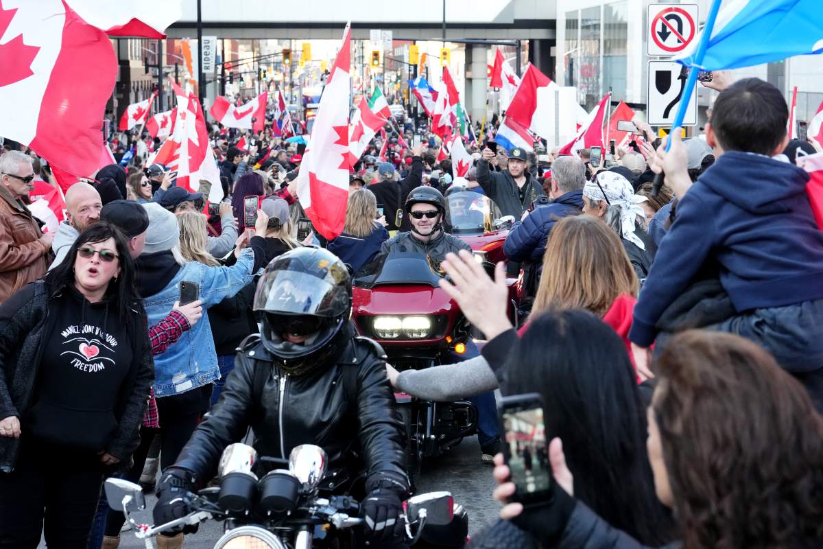 Protesters gather around motorcycles during a demonstration, part of a convoy-style protest participants are calling “Rolling Thunder”, in Ottawa, Friday, April 29, 2022.
