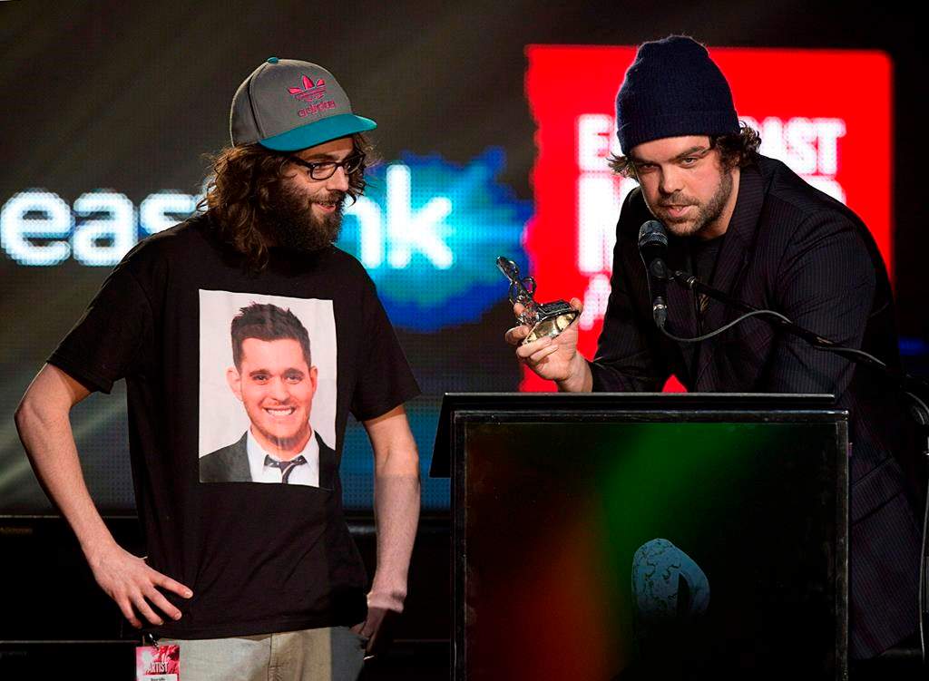 The Town Heroes, Bruce Gillis, left, and Mike Ryan receive the PEI 2014 fan's choice video of the year award for "New York City" at the East Coast Music Awards gala in Charlottetown on April 6, 2014. Events surrounding the 2022 East Coast Music Awards are set to get underway Wednesday in Fredericton, N.B. THE CANADIAN PRESS/Andrew Vaughan.