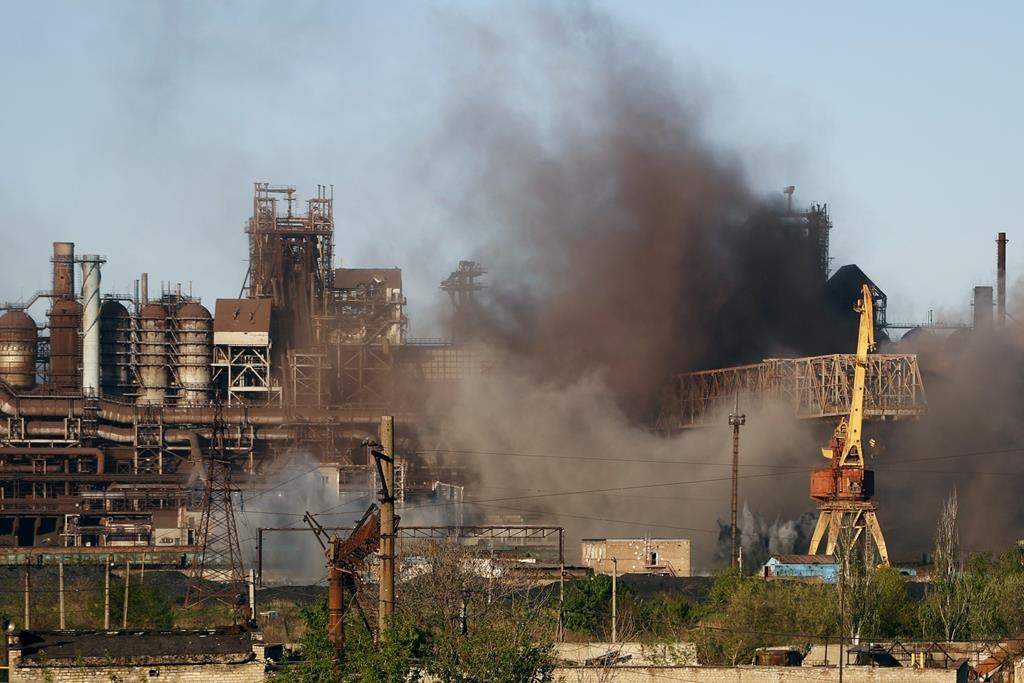 Smoke rises from the Metallurgical Combine Azovstal in Mariupol during shelling, in Mariupol, in territory under the government of the Donetsk People’s Republic, eastern Ukraine, Saturday, May 7, 2022.