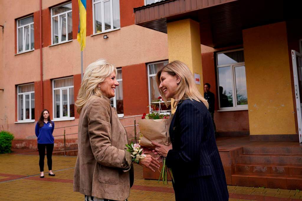First lady Jill Biden greets Olena Zelenskyy, spouse of Ukrainian’s President Volodymyr Zelenskyy, outside of School 6, a public school that has taken in displaced students in Uzhhorod, Ukraine, Sunday, May 8, 2022.