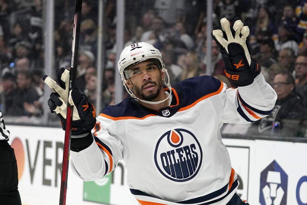 Edmonton Oilers left wing Evander Kane gestures after scoring an empty net goal during the third period in Game 6 of an NHL hockey Stanley Cup first-round playoff series against the Los Angeles Kings Thursday, May 12, 2022, in Los Angeles.