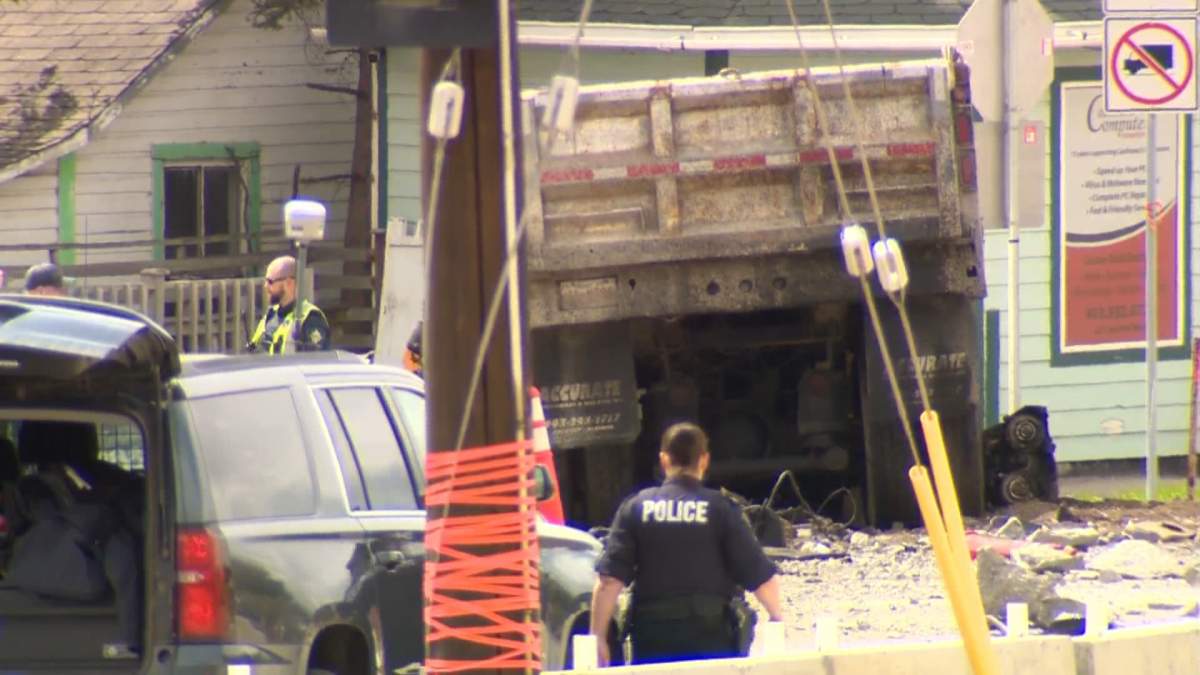 Officers investigate a serious collision in Cochrane, Alta., on May 24, 2022.