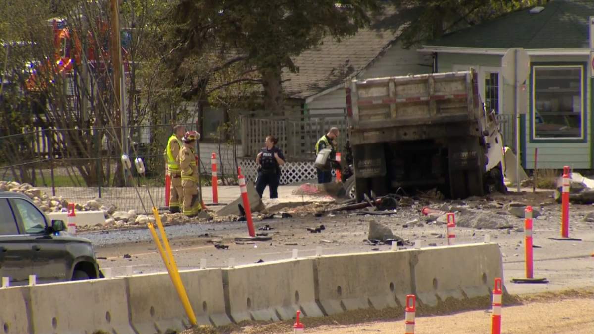 Officers investigate a serious collision in Cochrane, Alta., on May 24, 2022.