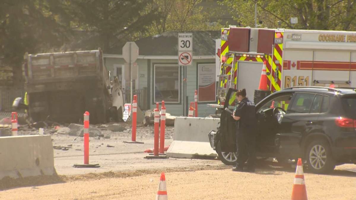 Officers investigate a serious collision in Cochrane, Alta., on May 24, 2022.