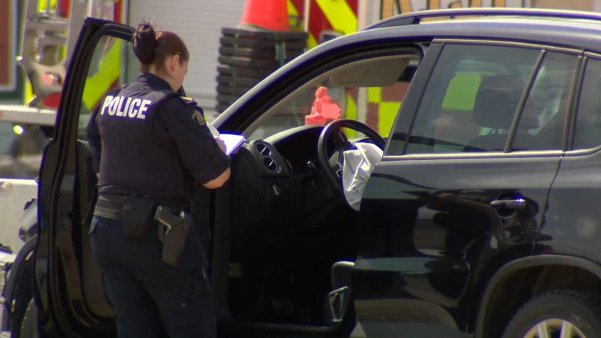 Officers investigate a serious collision in Cochrane, Alta., on May 24, 2022.