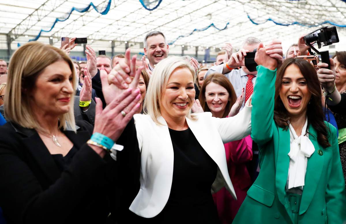 Sinn Fein's Vice President Michelle O'Neill, centre, celebrates with party colleagues after being elected in Mid Ulster at the Medow Bank election count centre in Magherafelt , Northern Ireland, Friday, May, 6, 2022. 