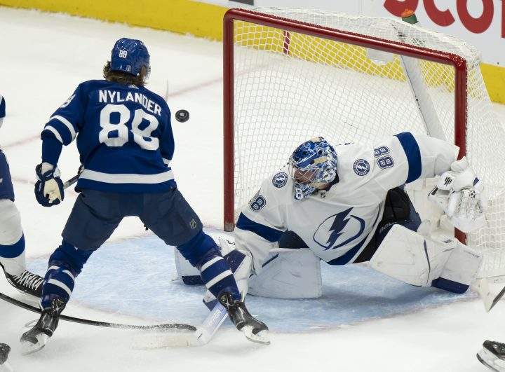Tampa Bay Lightning goaltender Andrei Vasilevskiy (88) makes a save on Toronto Maple Leafs right wing William Nylander (88) during second period NHL first round playoff action in Toronto on Tuesday May 10, 2022.