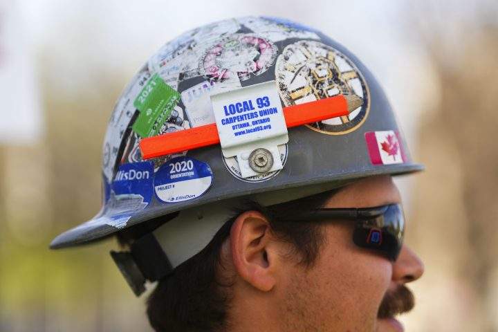 A member of the Ontario Chapter of the United Brotherhood of Carpenters and Joiners of America at a picket line Ottawa on Wednesday, May 11, 2022.