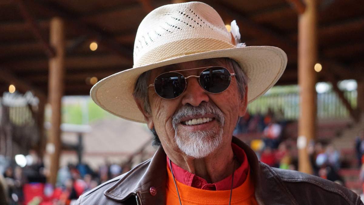 Federal Commissioner of Indigenous Languages Ron Ignace attends the one-year memorial for the suspected 215 children buried in unmarked graves outside the former Kamloops Indian Residential School on May 23, 2022.