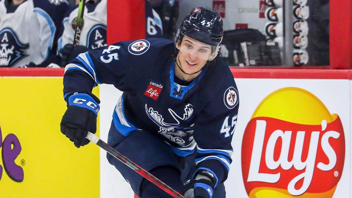 Manitoba Moose forward Morgan Barron dishing a pass during the first round of the AHL playoffs against the Milwaukee Admirals at Canada Life Centre.