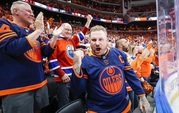Edmonton Oilers fans celebrate their teams defat of the Calgary Flames following third period NHL second-round playoff hockey action in Edmonton, Tuesday, May 24, 2022.