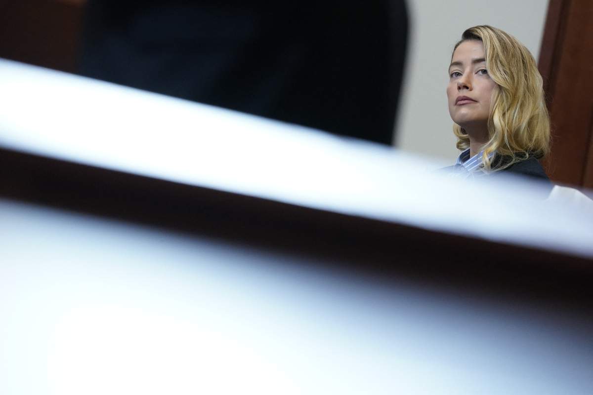 Amber Heard stands in the courtroom at the Fairfax County Circuit Court during a defamation case against her by ex-husband, U.S. actor Johnny Depp, in Fairfax, Virginia, on May 4, 2022.