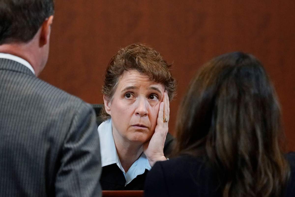 Judge Penney Azcarate talks to attorneys during bench conference in the courtroom after a break at the Fairfax County Circuit Courthouse in Fairfax, Virginia, on May 16, 2022