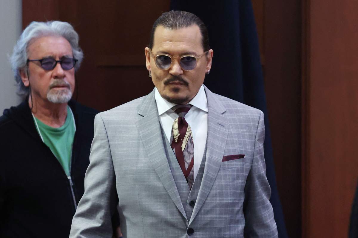 US actor Johhny Depp arrives with Celebrity therapist Beechy Colclough (L) at the Fairfax County Circuit Courthouse in Fairfax, Virginia, on May 26, 2022.