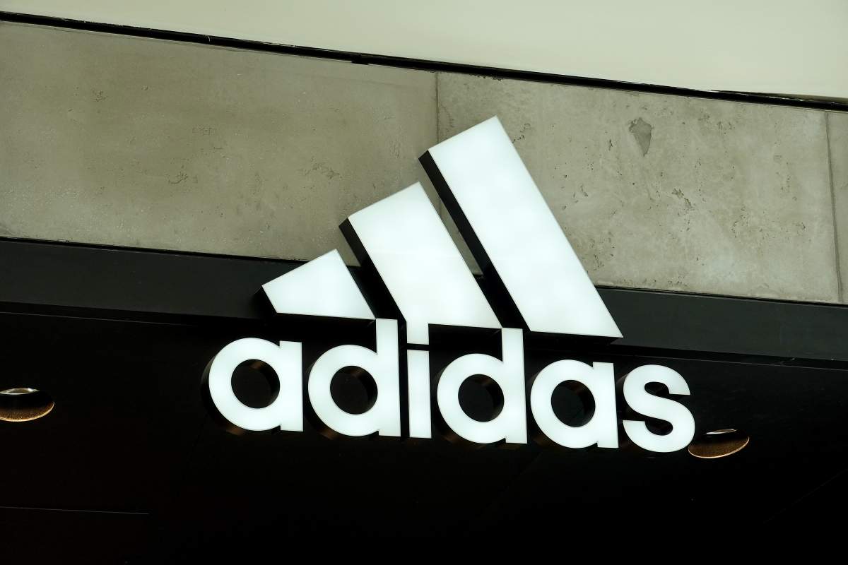 An Adidas sign at the entrance to the store on August 12, 2021 in Miami, Florida.
