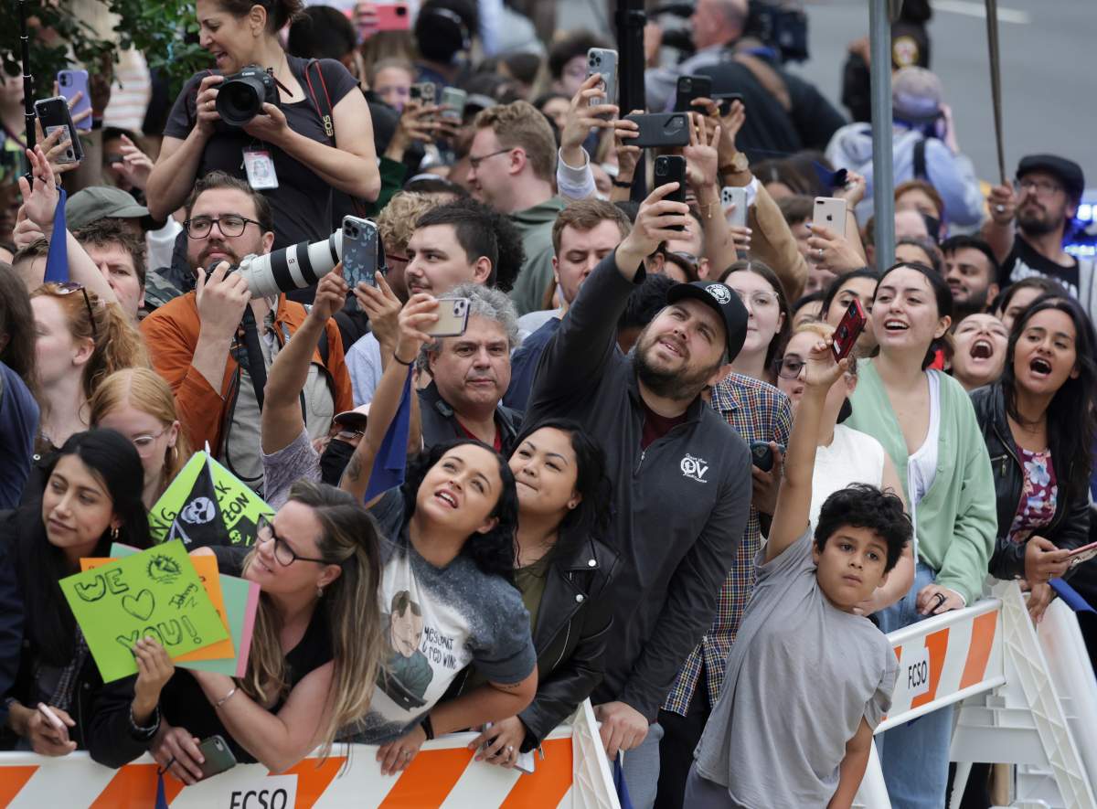 People cheer as actor Johnny Depp arrives for trial at a Fairfax County Courthouse on May 27, 2022 in Fairfax, Virginia