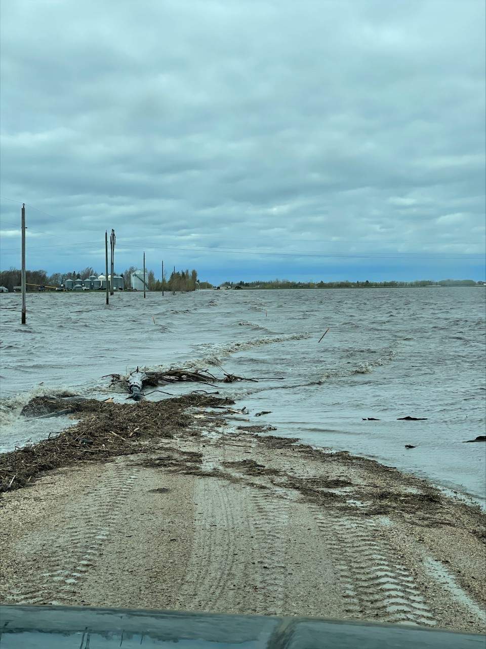 Egg farmer Harley Siemens said about 10 to 12 inches flooded the road into his farm on Thursday, but the water rose another 10 inches by the next day.