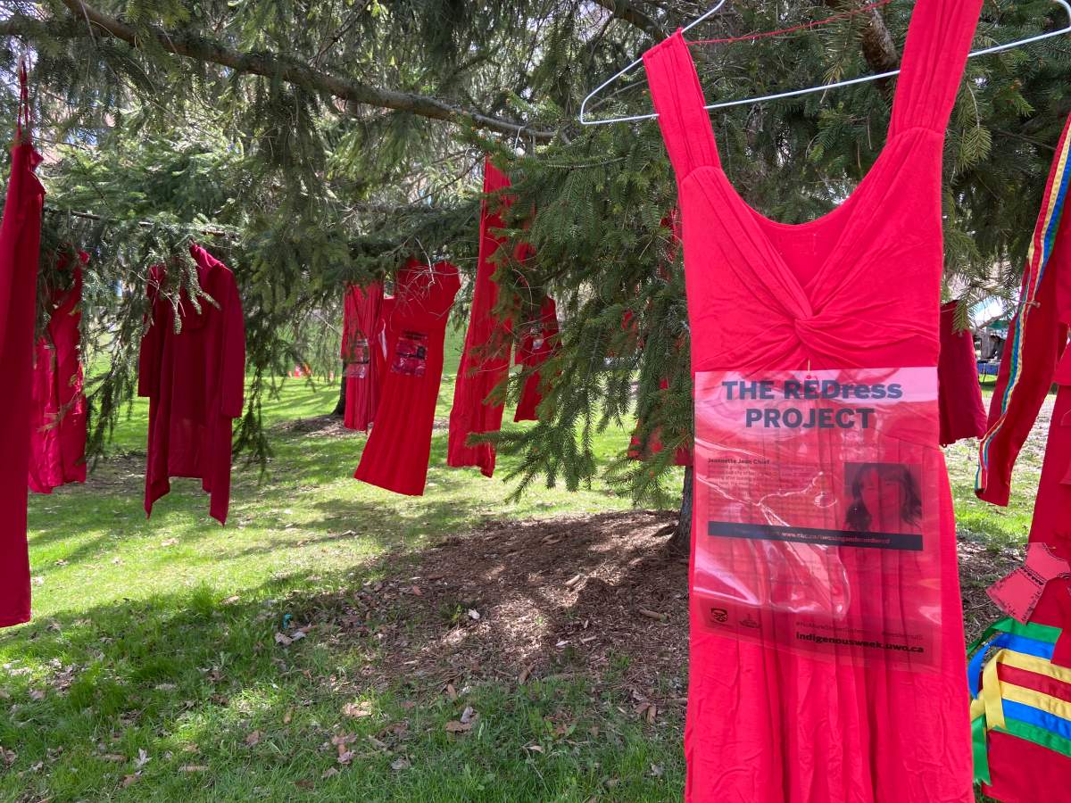 A red dress hanging in a tree in honor of the missing and murder Indigenous women.
