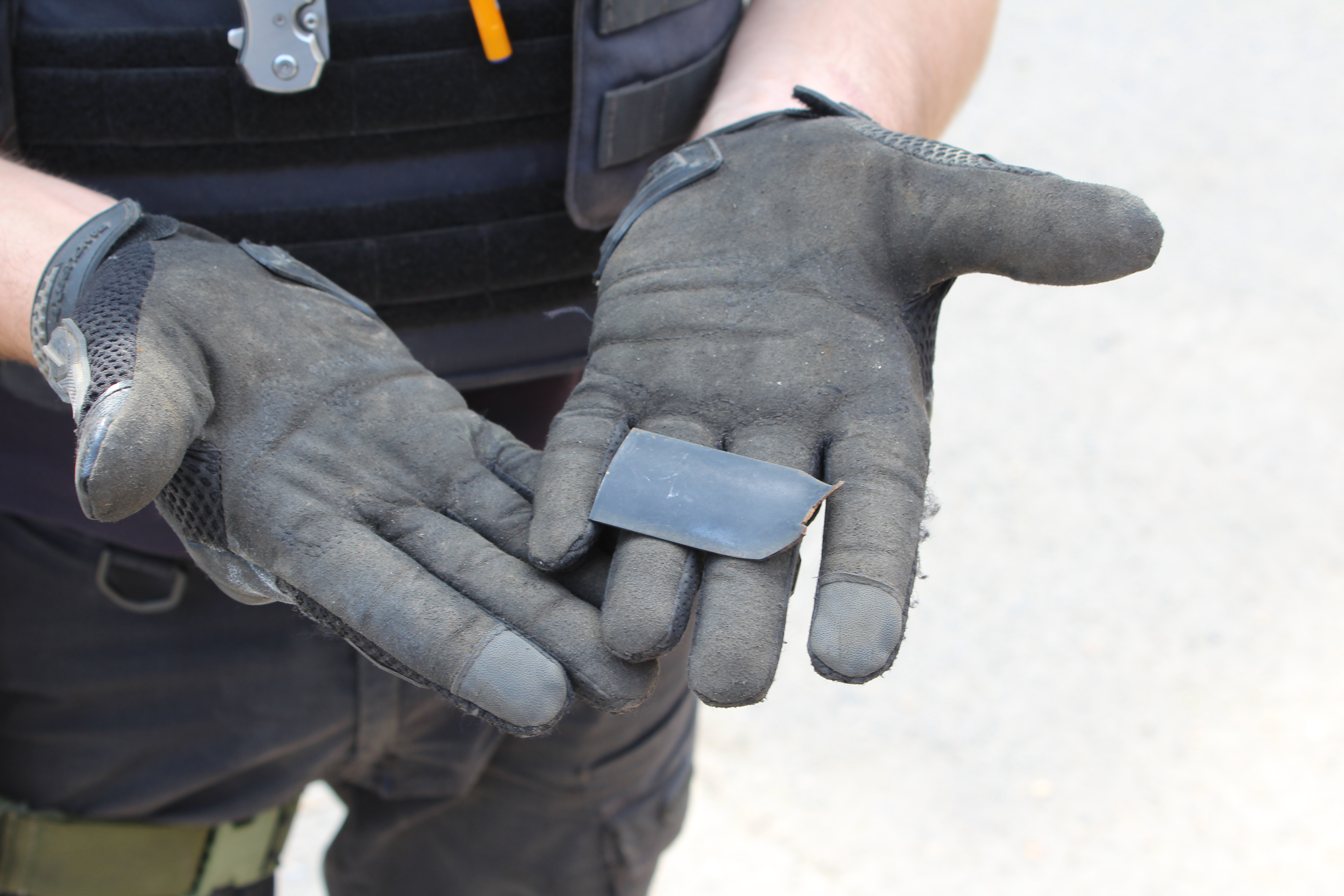 Ukrainian ordinance disposal worker shows tail fin of Russian cluster munition found in Kharkiv’s Saltivka district on May 21, 2022.