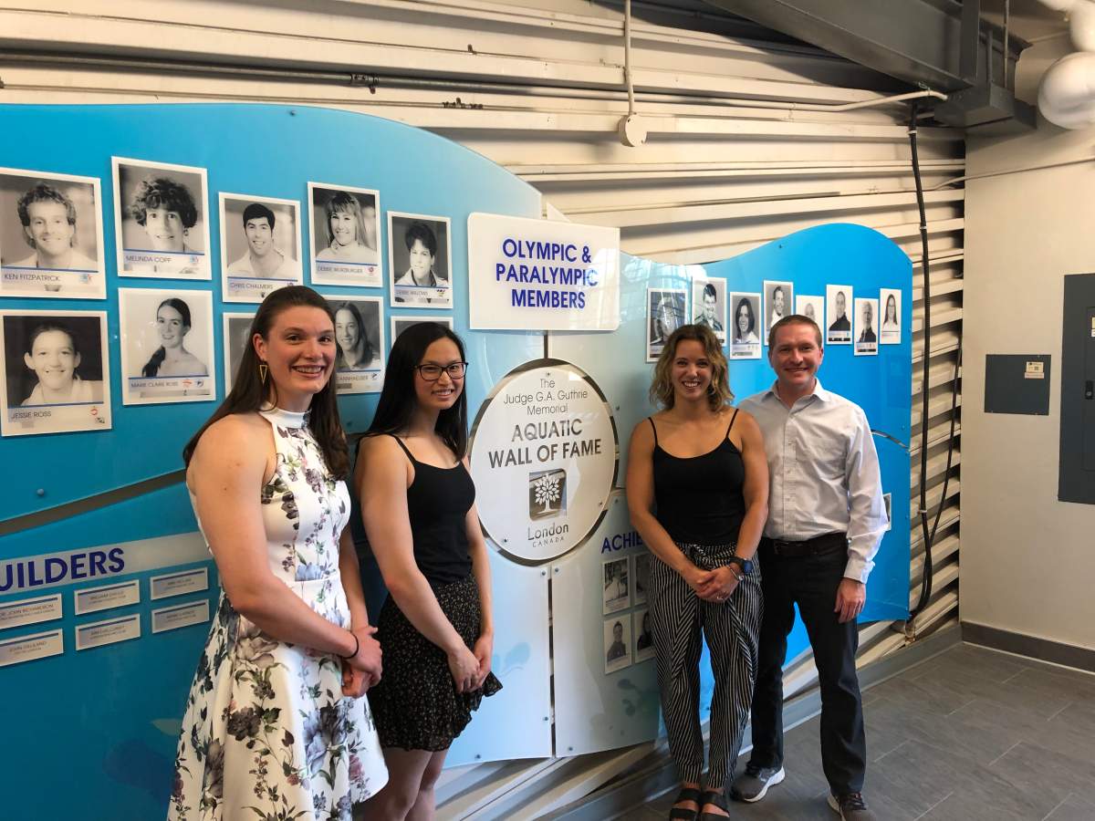 Charis Huddle, Maggie Mac Neil and Jillian Best are joined by Acting Mayor Josh Morgan after the three were inducted into the Aquatic Wall of Fame in London, Ont.,