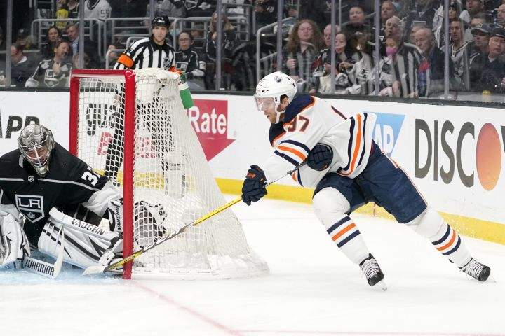 Edmonton Oilers center Connor McDavid, right, scores on Los Angeles Kings goaltender Jonathan Quick during the first period in Game 6 of an NHL hockey Stanley Cup first-round playoff series Thursday, May 12, 2022, in Los Angeles.