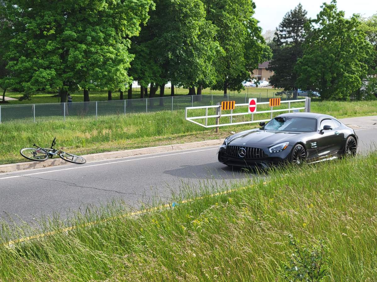 Police are investigating after a 15-year-old boy was struck by a vehicle while riding his bike in Toronto.