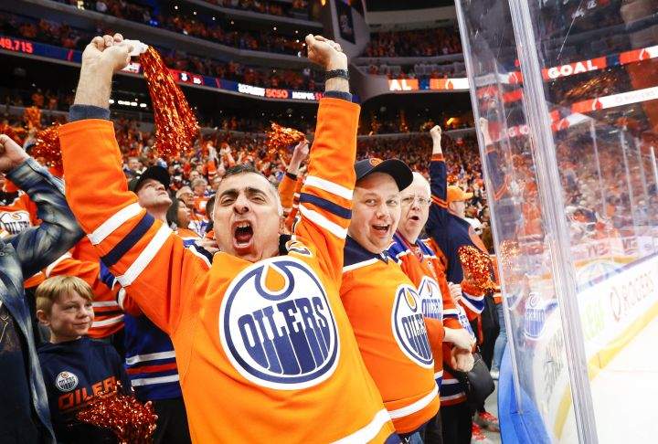 Edmonton Oilers fans cheer a goal during third period NHL playoff hockey action against the Los Angeles Kings in Edmonton, Tuesday, May 10, 2022.