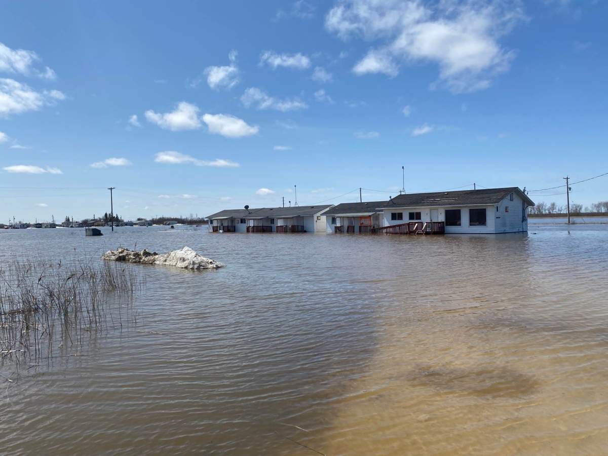 Water surrounds a home on Peguis First Nation in spring 2022.