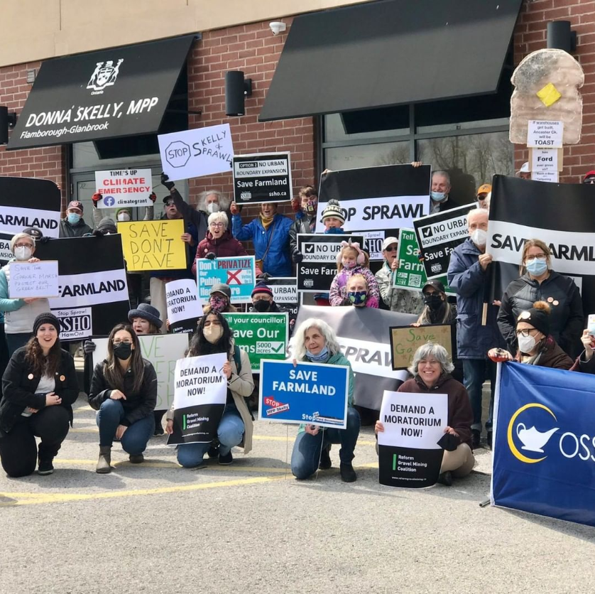 Supporters of 'Stop Sprawl Hamilton' rally against a proposal to expand the city's urban boundary, which they say will lead to more sprawl.