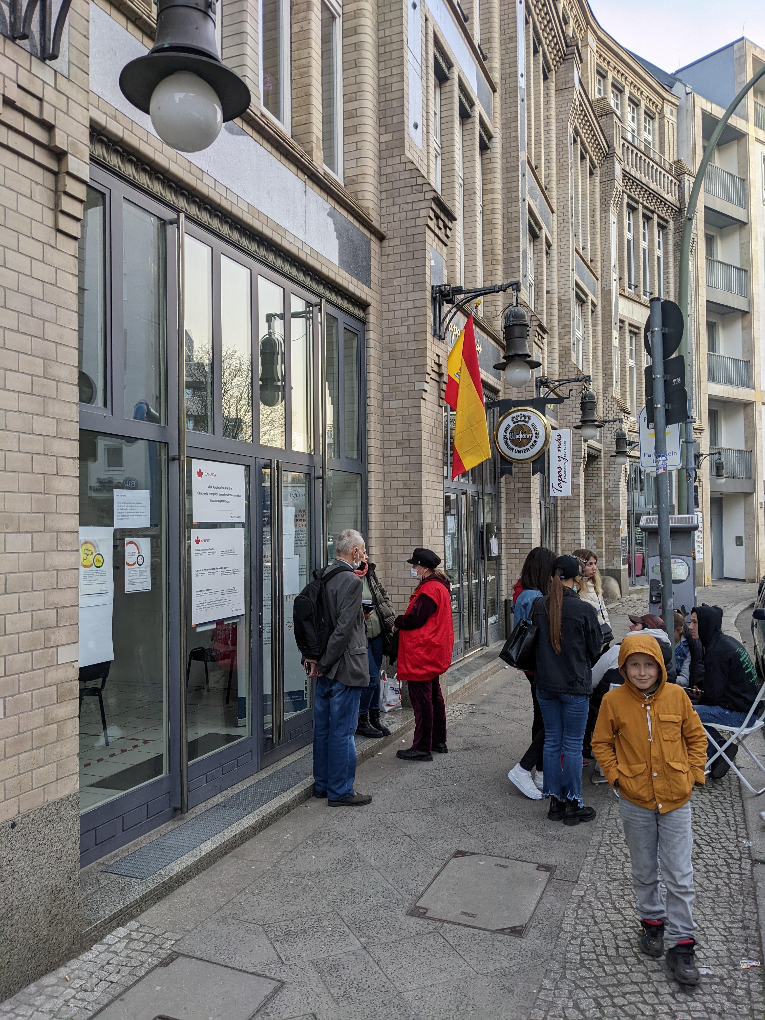 People waiting outside VFS Global visa application centre in Berlin, Germany.