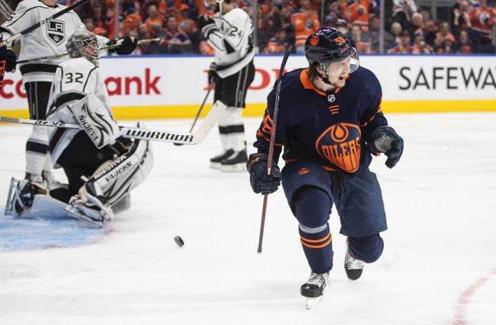 Los Angeles Kings’ goalie Jonathan Quick (32) looks on as Edmonton Oilers’ Kailer Yamamoto (56) celebrates a goal during second period of first round, game one NHL playoff action in Edmonton, Monday, May 2, 2022.