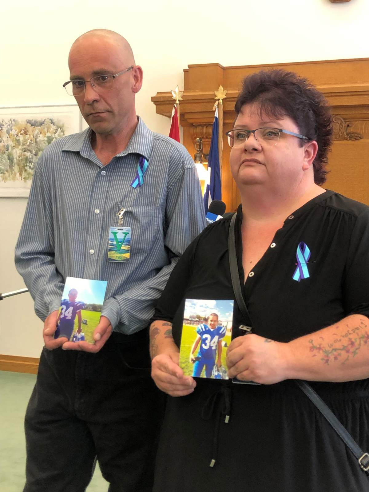 Chris and Wanda Ball hold pictures of their son Kye, who passed away in 2017 at the age of 16.