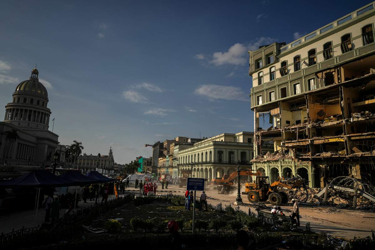 Rescue teams remove debris from the site of a deadly explosion at a Havana hotel.