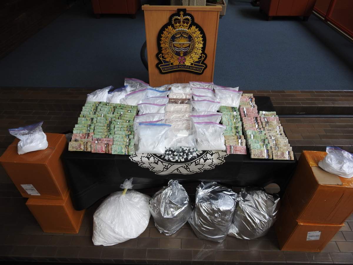 Four men have been charged after $1.3 million worth of drugs, cash, ammunition and vehicles were seized following a 14-month investigation in south and southwest Edmonton.
