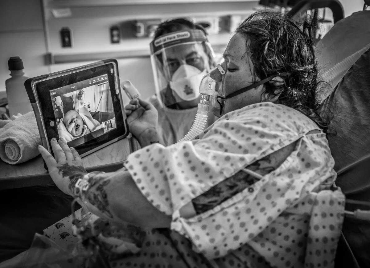 Christine Wesley, diagnosed with COVID-19 sees her newborn baby on FaceTime.