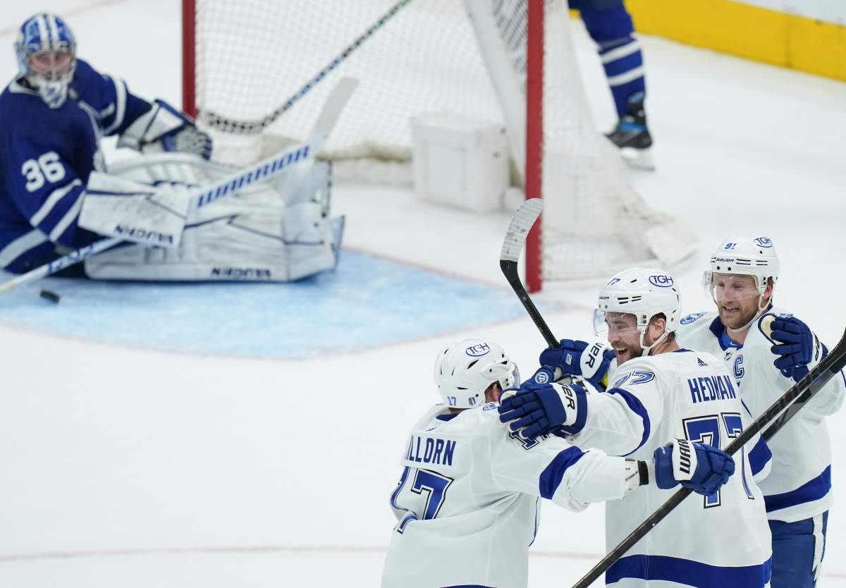Tampa Bay Lightning defenceman Victor Hedman (77) celebrates his goal with teammates Alex Killorn (17) forward Steven Stamkos (91) after scoring past Toronto Maple Leafs goaltender Jack Campbell (36) during first period, round one, NHL Stanley Cup playoff hockey action in Toronto on Wednesday, May 4, 2022. THE CANADIAN PRESS/Nathan Denette