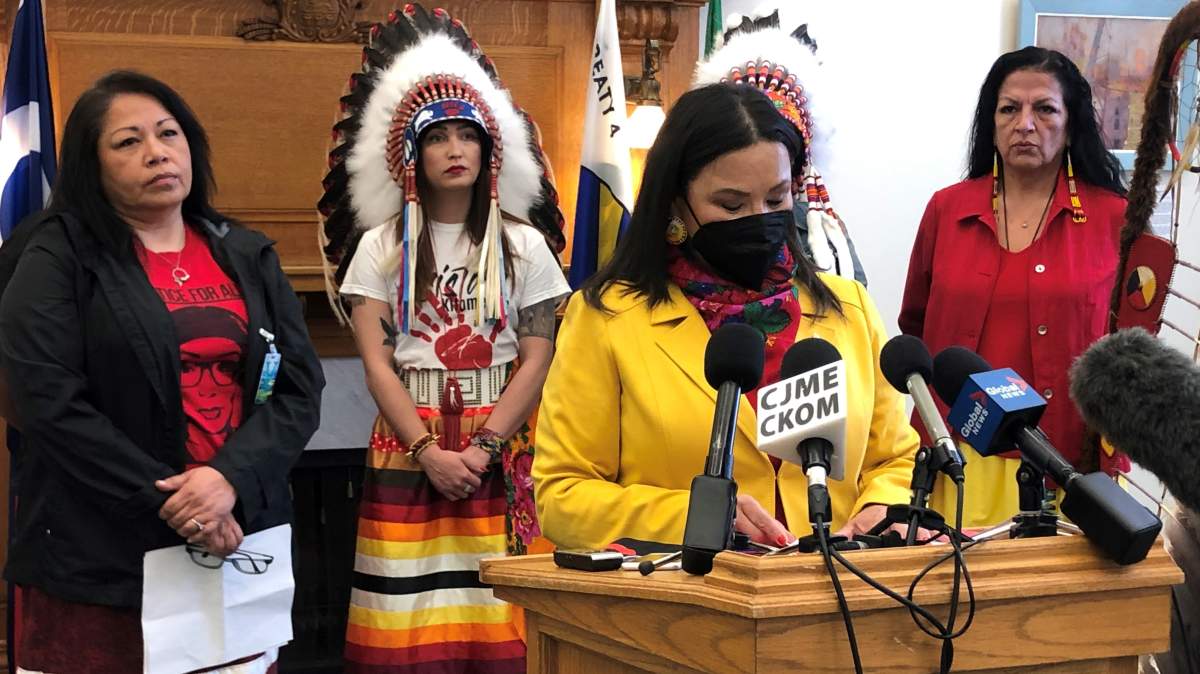 Betty Nippi-Albright speaks to reporters surrounded by family members of missing or murdered Indigenous women and girls. 