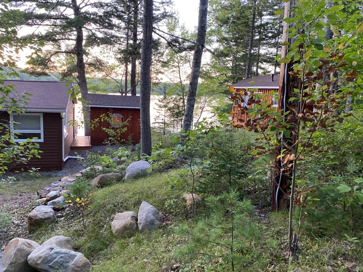 A man has been charged with willfully promoting hatred 18 months after a sign featuring an image of a noose was spotted on his cabin.