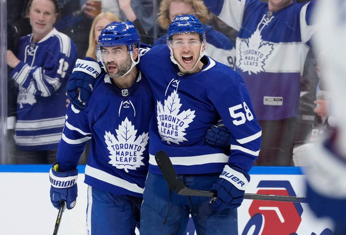 Toronto Maple Leafs left wing Michael Bunting (58) celebrates his goal with teammate defenceman Mark Giordano (55) during second period NHL first-round playoff series action against the Tampa Bay Lightning goaltender Andrei Vasilevskiy in Toronto on Wednesday, May 4, 2022. THE CANADIAN PRESS/Frank Gunn