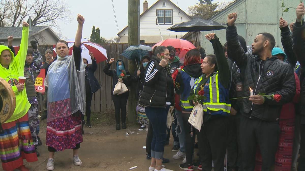 Family, friends hold vigil for 24-year-old homicide victim - image